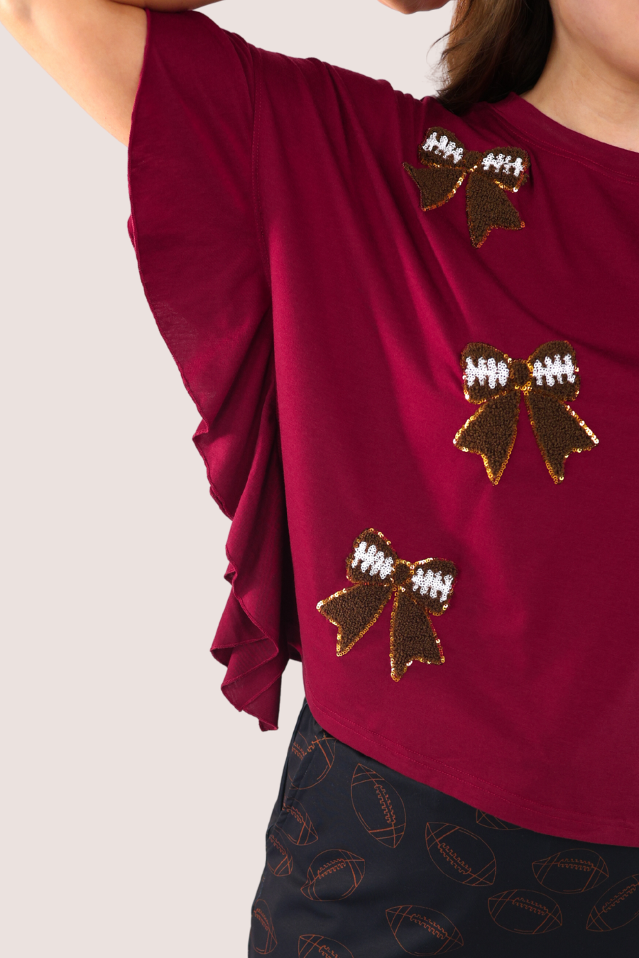 Sideline Sparkle Ruffle Top- Maroon